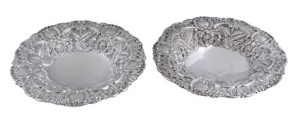 A pair of George IV silver shaped circular dessert dishes by S.C. Younge  &  Co.,   Sheffield 1824