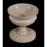 An ivory urn-shaped pedestal salt cellar,   early 19th century, 8.5cm high