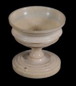 An ivory urn-shaped pedestal salt cellar,   early 19th century, 8.5cm high