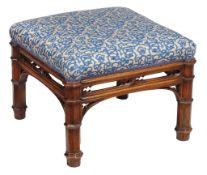 A Victorian Gothic Revival walnut stool  , circa 1860,  the stuffed square seat over a pierced