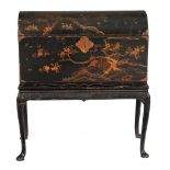 An Anglo- Chinese black lacquer and gilt decorated chest on stand  , the chest circa 1700,  with