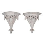 A pair of George III white painted wood wall brackets , circa 1760, of faceted gothic ogee arch