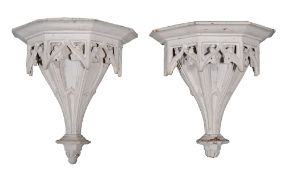 A pair of George III white painted wood wall brackets , circa 1760, of faceted gothic ogee arch