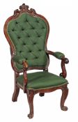 A Victorian rosewood armchair  , circa 1850,  with an arched padded back, padded arms and padded