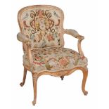 A George III armchair  , circa 1770, in the manner of Linnell,  the cartouche shaped back, seat and