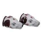 A pair of Staffordshire hound's head stirrup cups  , early 19th century,  each with brown ears and