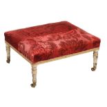 A George III cream painted and parcel gilt footstool,   circa 1800,  the padded crimson velvet