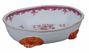 An oval Chinese jardiniÃ¨re,   Qing Dynasty, Qianlong (1736-95),  supported on four coral coloured s