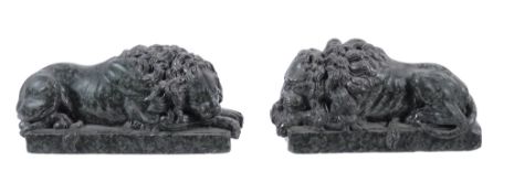 A pair of Italian sculpted serpentine marble models of recumbent lions,   19th century,   after
