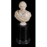 A carved ivory bust of Shakespeare,   late 18th/ early 19th century,  on a small circular socle,