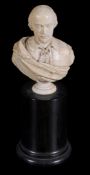 A carved ivory bust of Shakespeare,   late 18th/ early 19th century,  on a small circular socle,