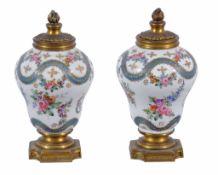 A pair of small French porcelain vases  , late 19th century,  decorated in the SÃ¨vres style with