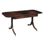 A Regency mahogany sofa table,   circa 1815, the rounded top with drop sides, with two frieze