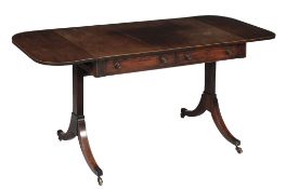 A Regency mahogany sofa table,   circa 1815, the rounded top with drop sides, with two frieze