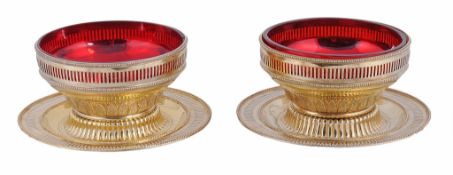 A pair of Victorian silver gilt dessert dishes on stands by F. B. Thomas  &  Co.,   London 1875,