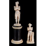 A Dieppe ivory figure of Napoleon,    standing with folded arms on a small circular base (damaged),