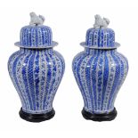 A pair of Japanese blue and white baluster vases and covers,   19th century,   49cm high overall