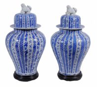 A pair of Japanese blue and white baluster vases and covers,   19th century,   49cm high overall