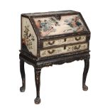 A Chinese Export lacquered bureau,   late 18th century, the bureau with floral decoration and