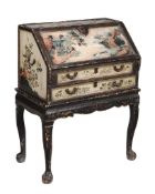 A Chinese Export lacquered bureau,   late 18th century, the bureau with floral decoration and