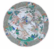 A Chinese famille verte circular dish, Qing Dynasty  , Kangxi (1662-1722),  the centre enamelled