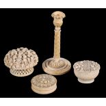 Four items of Continental carved ivory,   19th century, comprising; a columnar taper-stick, 15.5cm