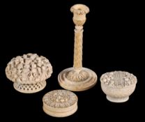 Four items of Continental carved ivory,   19th century, comprising; a columnar taper-stick, 15.5cm
