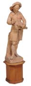 A late 18th century French large terracotta figure of a hurdy gurdy player after F. Roucourt  ,