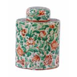 A Continental faience canister and cover  ,  decorated in green and red  with foliage, 14.5cm high