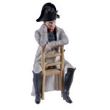 A Continental biscuit porcelain figure of Napoleon Bonaparte,   modelled  sitting on a chair, 31.