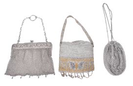 Two silver coloured mesh evening bags,   one with a pierced hinged frame opening, unmarked; the