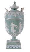 A Wedgwood sage-green-jasper two handled vase and cover  , circa 1900,  sprigged in white relief