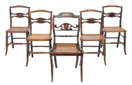 A set of four WIlliam IV grained rosewood chairs  , circa 1835,  with turned top rails and scroll