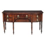 A Regency mahogany and inlaid sideboard,   circa 1815, with a bowfront top, the two central drawers