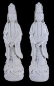 A pair of large Chinese Dehua figures of Guanyin  , Qing Dynasty, 19th century,  standing on oval