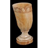 A carved ivory tusk vase,   19th century, the rim carved with a band of fruiting vine, on a