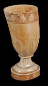 A carved ivory tusk vase,   19th century, the rim carved with a band of fruiting vine, on a