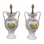 A pair of Staffordshire vases  , circa 1840,  with branch handles, the sides painted with