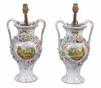 A pair of Staffordshire vases  , circa 1840,  with branch handles, the sides painted with