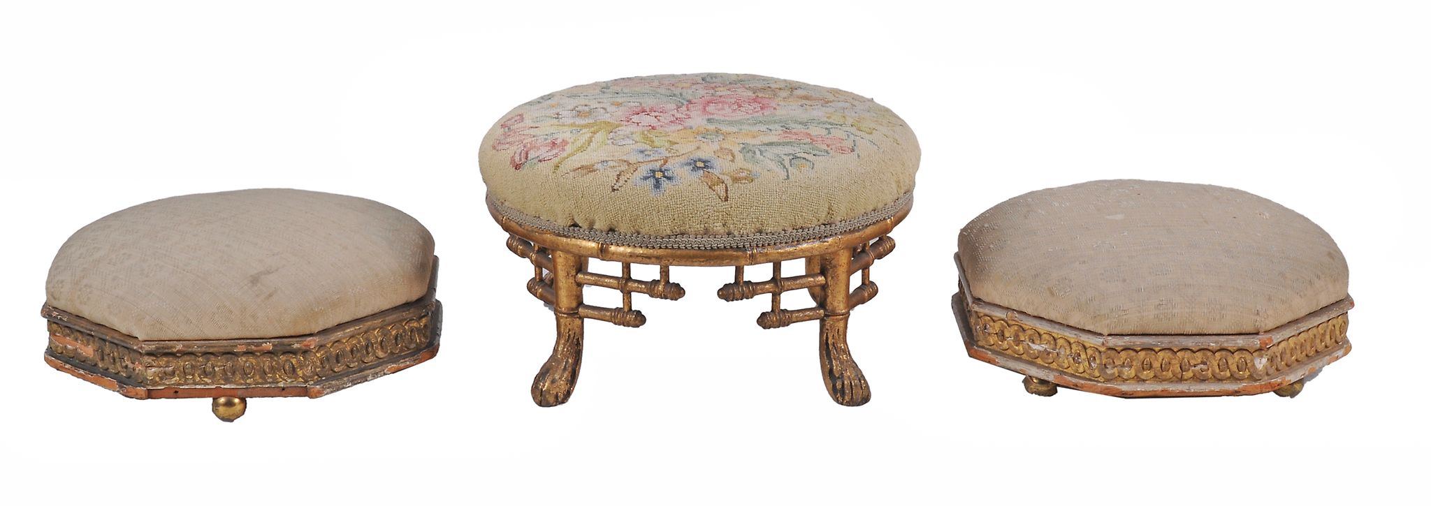 A pair of Victorian carved giltwood and upholstered octagonal footstools  , 28cm diameter;