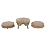 A pair of Victorian carved giltwood and upholstered octagonal footstools  , 28cm diameter;