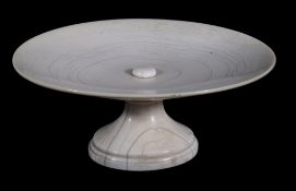 An oval ivory tazza,   18th century,  on domed oval reeded foot, 17.5cm diameter