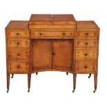 A George III satinwood and ebony strung washstand  , circa 1790,  the divided hinged top enclosing