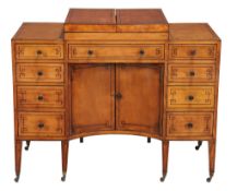 A George III satinwood and ebony strung washstand  , circa 1790,  the divided hinged top enclosing