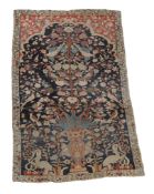 A Tabriz prayer rug, Northwest Persia  , circa 1870,  the blue mihrab, with a vase issuing a