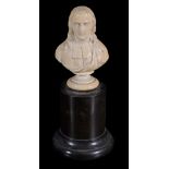 A carved ivory bust of a cleric,   French, 18th century,  wearing long hair to his shoulders, on a