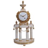 A Louis XVI style gilt brass and white marble mantel timepiece, unsigned, early 19th century,   the