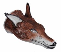 A Staffordshire pearlware fox head stirrup cup  , circa 1800,  with painted brown  head, mouth and