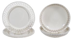 A pair of English creamware shallow bowls and associated plates,   circa 1775-85,  with pierced