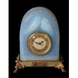 An American opalescent glass clock,   1930s, moulded with birds amidst blossom, with internal